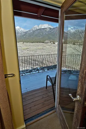 a view of balcony with wooden floor
