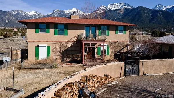 a view of a house with a tree