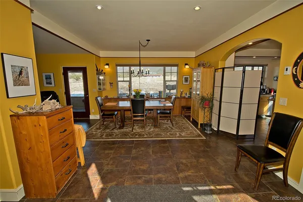 a view of a livingroom with furniture staircase and front door