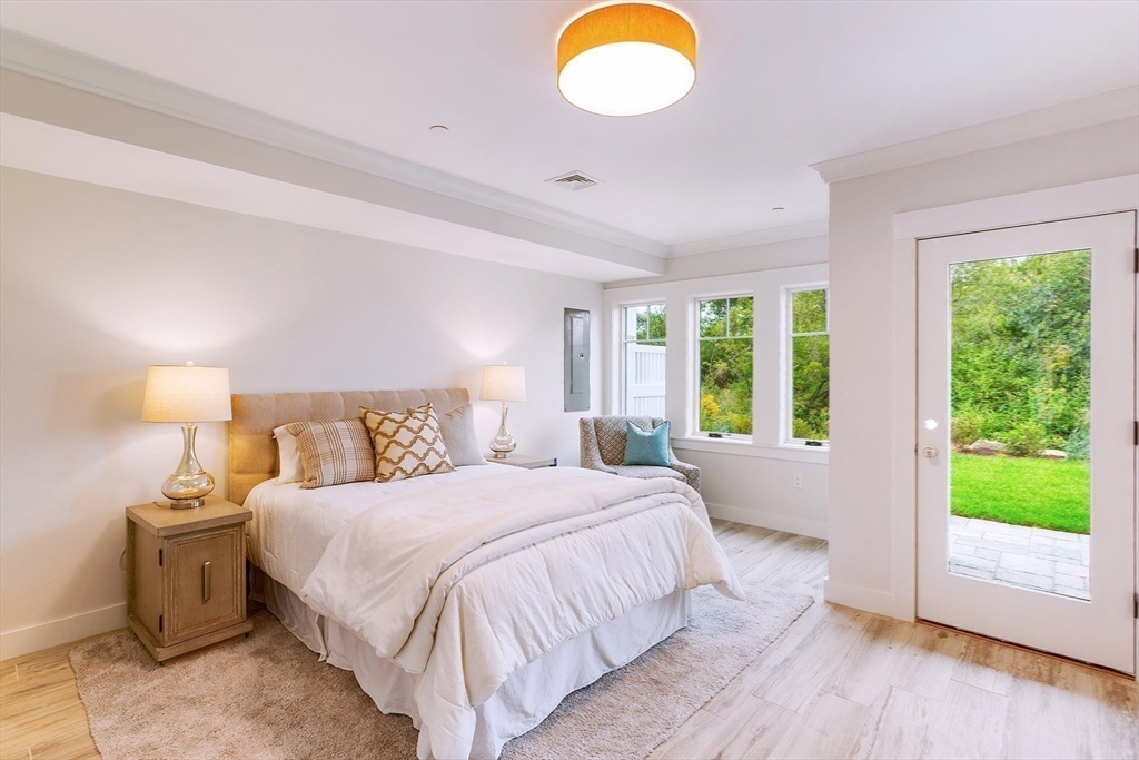 163 Atlantic Road, Unit 10 Gloucester, MA 01930 - Photo 17 of 23 a bedroom with a bed and a windows