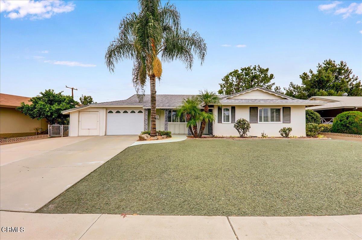 26204 Ridgemoor Road Menifee, CA 92586 - Photo 1 of 35 a front view of a house with a garden