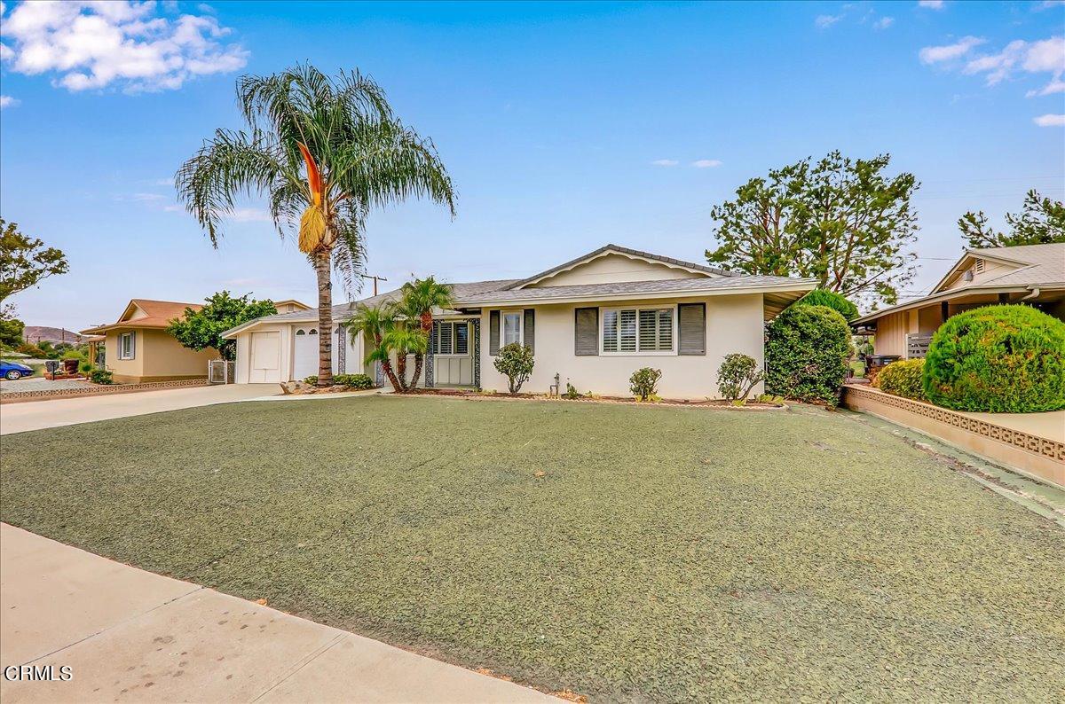 26204 Ridgemoor Road Menifee, CA 92586 - Photo 2 of 35 a front view of a house with a garden
