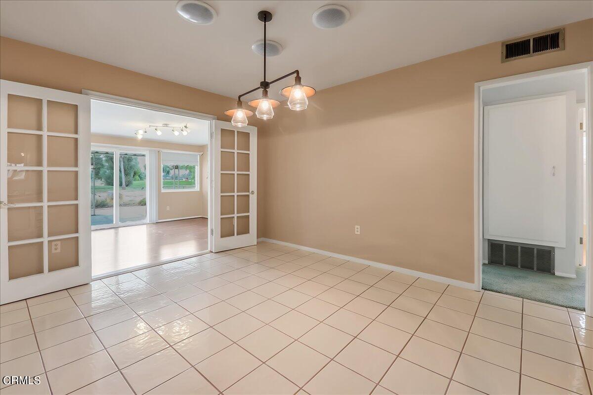 26204 Ridgemoor Road Menifee, CA 92586 - Photo 12 of 35 a view of an empty room with a window
