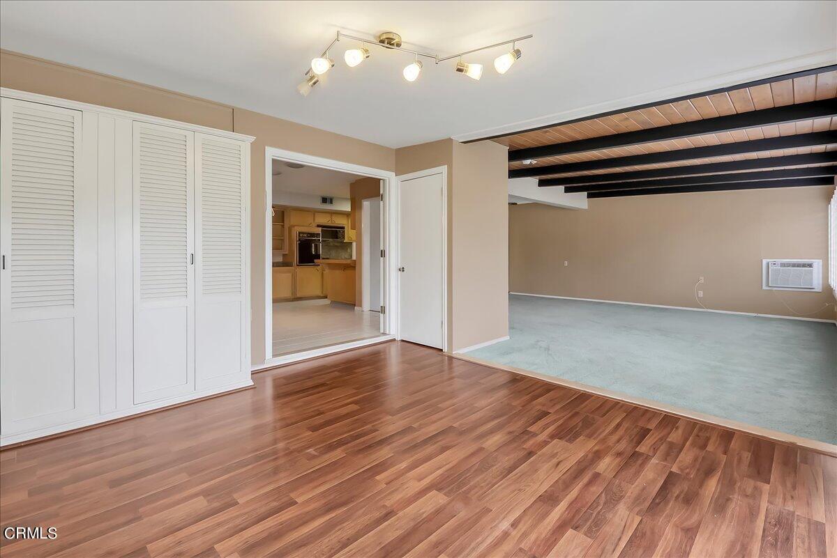 26204 Ridgemoor Road Menifee, CA 92586 - Photo 18 of 35 wooden floor in an empty room with a window