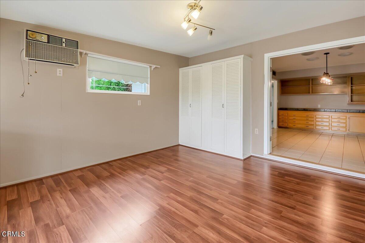26204 Ridgemoor Road Menifee, CA 92586 - Photo 19 of 35 wooden floor in an empty room with a window