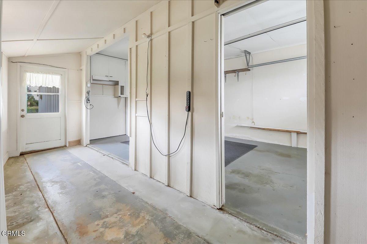 26204 Ridgemoor Road Menifee, CA 92586 - Photo 26 of 35 a view of a bathroom with a walk in closet and wooden floor