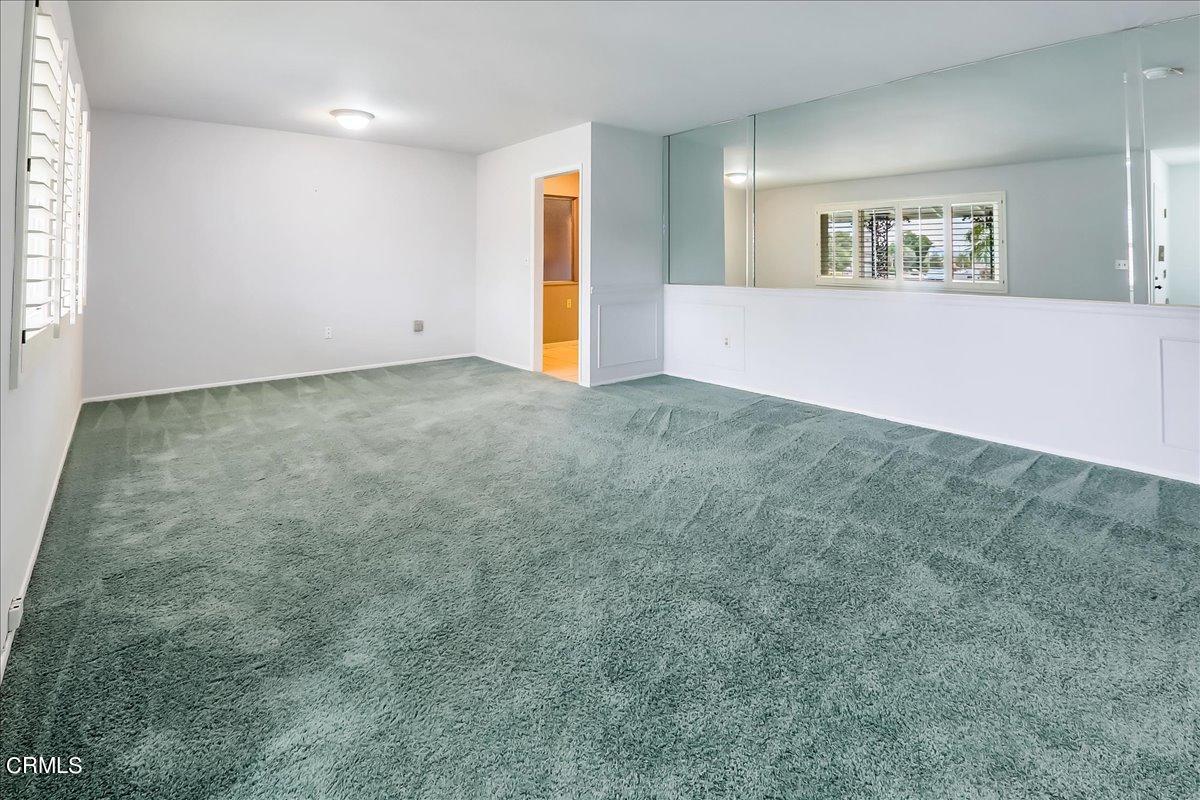 26204 Ridgemoor Road Menifee, CA 92586 - Photo 4 of 35 an empty room with a window and a projector