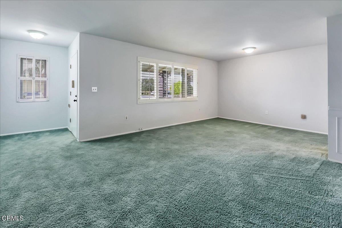 26204 Ridgemoor Road Menifee, CA 92586 - Photo 5 of 35 an empty room with windows