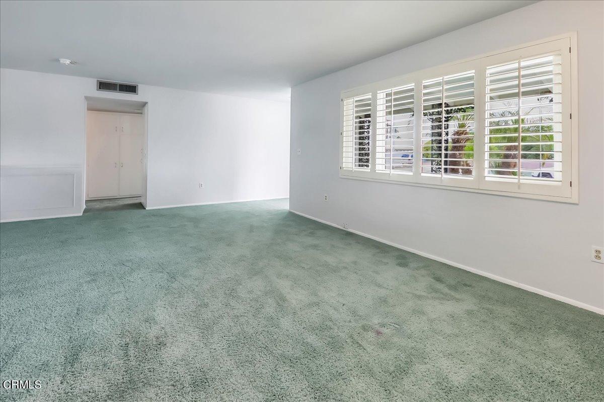 26204 Ridgemoor Road Menifee, CA 92586 - Photo 6 of 35 an empty room with a window
