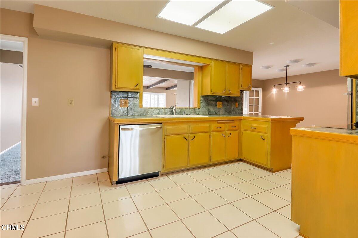 26204 Ridgemoor Road Menifee, CA 92586 - Photo 8 of 35 a kitchen with a sink and a refrigerator