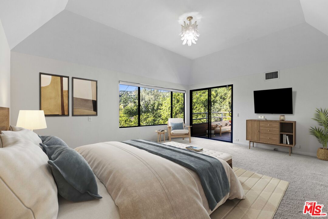 3275 Buckingham Road Glendale, CA 91206 - Photo 22 of 33 a bedroom with a bed and a flat screen tv