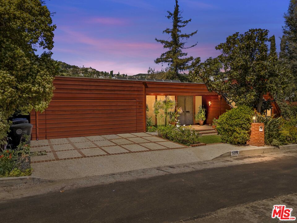 3275 Buckingham Road Glendale, CA 91206 - Photo 3 of 33 a front view of a house with a garden