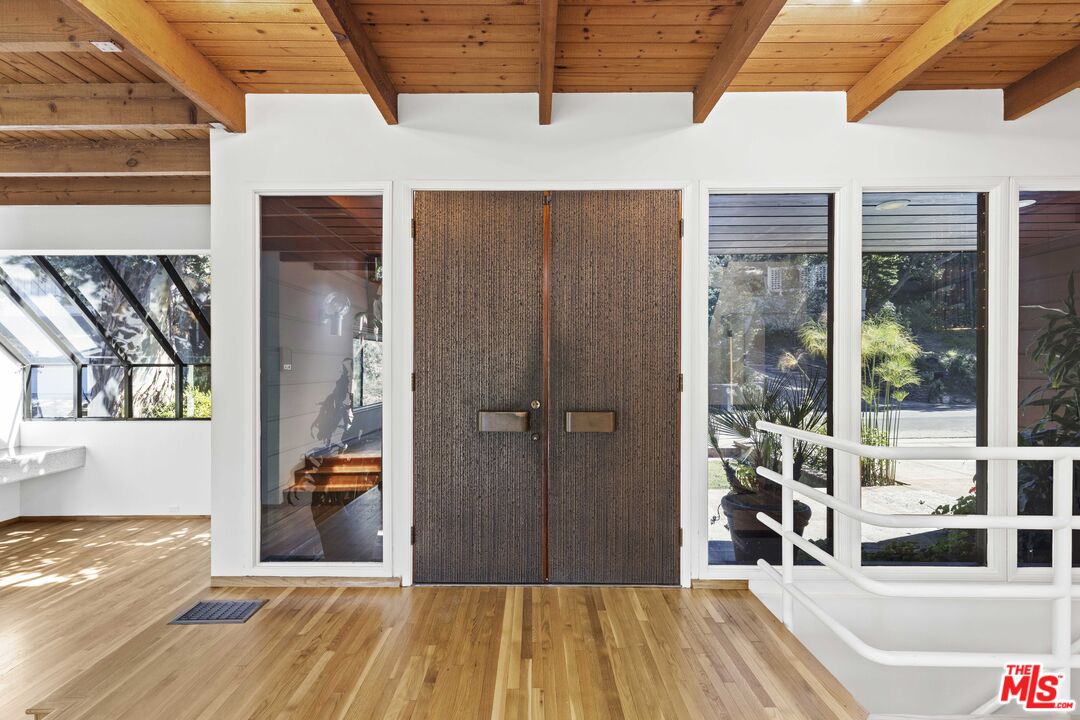 3275 Buckingham Road Glendale, CA 91206 - Photo 6 of 33 a view of a living room and bathroom with a bathtub