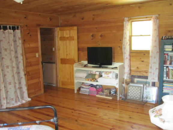 1405 Poor Farm Road Southeast Floyd, VA 24091 - Photo 22 of 46 a living room with furniture and a flat screen tv