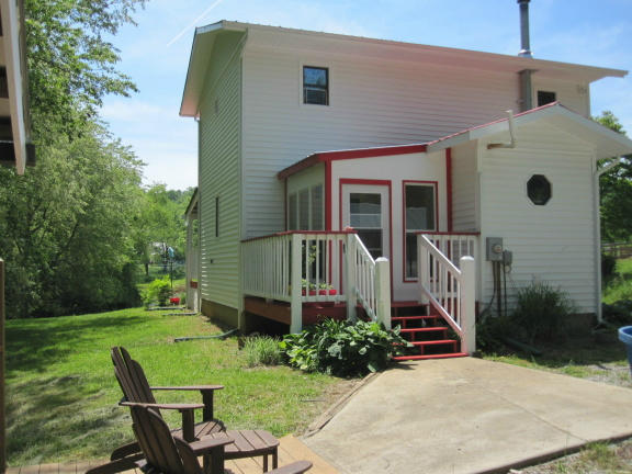 1405 Poor Farm Road Southeast Floyd, VA 24091 - Photo 4 of 46 a view of a house with backyard and sitting area