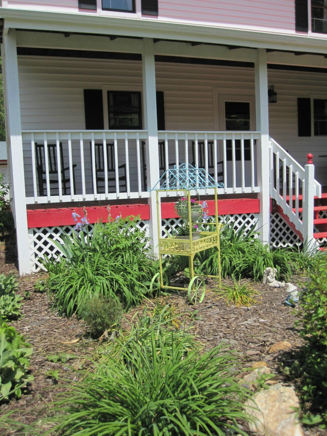 1405 Poor Farm Road Southeast Floyd, VA 24091 - Photo 39 of 46 a view of a house with a small yard and flower plants
