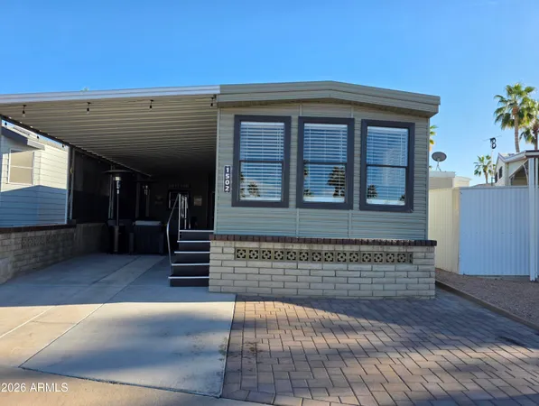 a view of front door of house with stairs