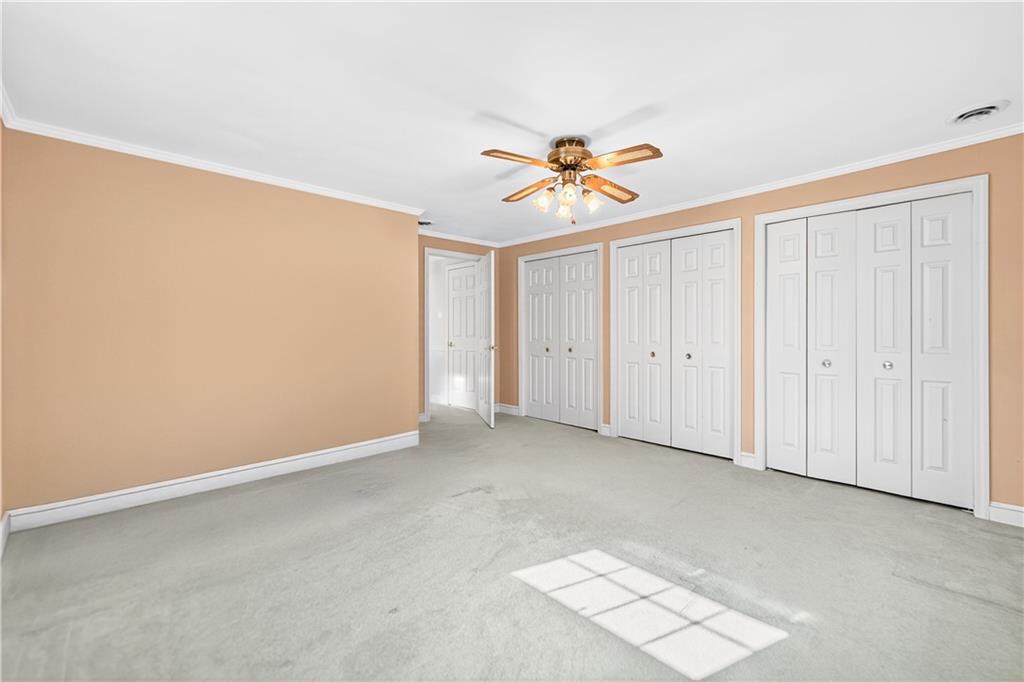 1801 McCorkle Road South Park, PA 15129 - Photo 11 of 49 an empty room with windows and a chandelier fan
