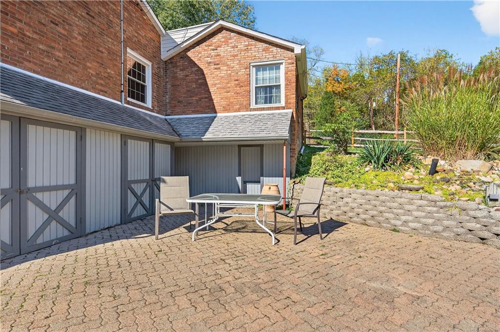 1801 McCorkle Road South Park, PA 15129 - Photo 22 of 49 a view of a house with backyard and sitting area