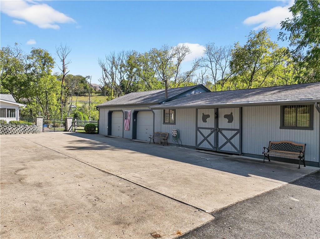 1801 McCorkle Road South Park, PA 15129 - Photo 3 of 49 a front view of a house with a garden