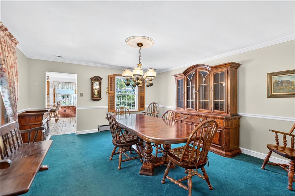 1801 McCorkle Road South Park, PA 15129 - Photo 31 of 49 a dining room with furniture a chandelier and wooden floor