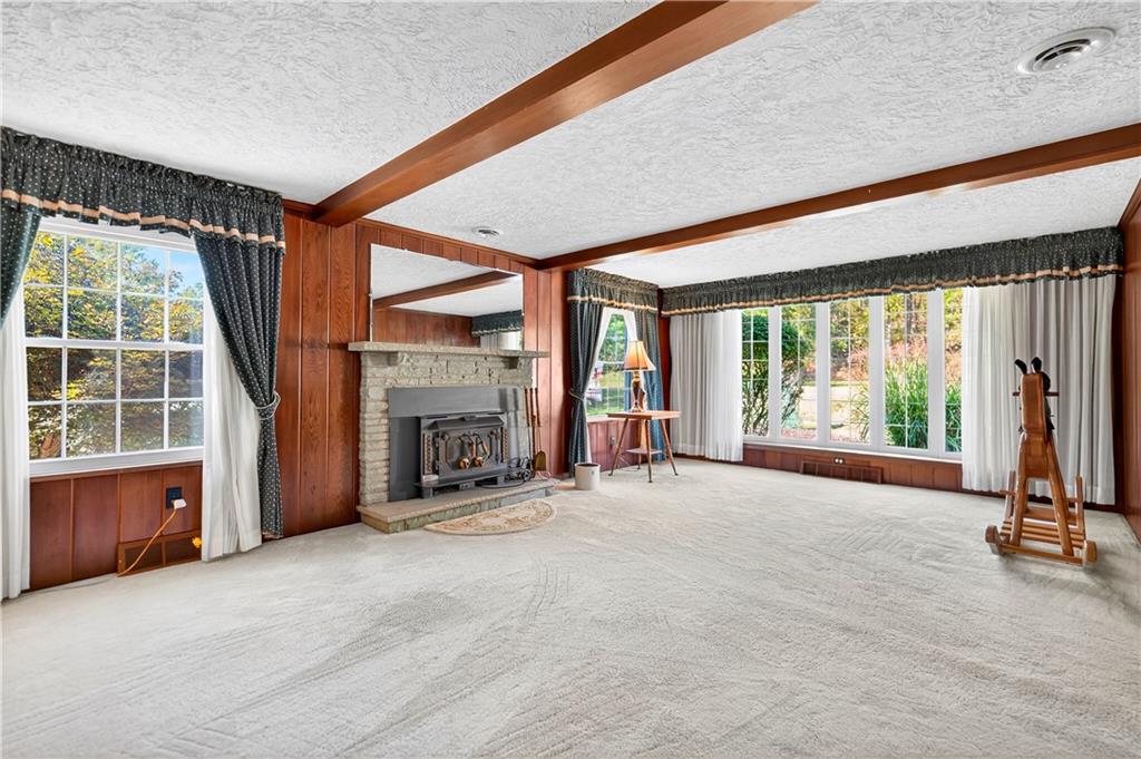 1801 McCorkle Road South Park, PA 15129 - Photo 32 of 49 an empty room with furniture and a fireplace