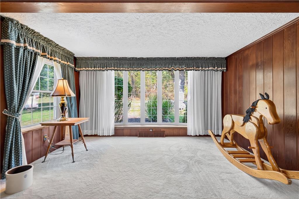 1801 McCorkle Road South Park, PA 15129 - Photo 33 of 49 a living room with furniture a bed and a large window