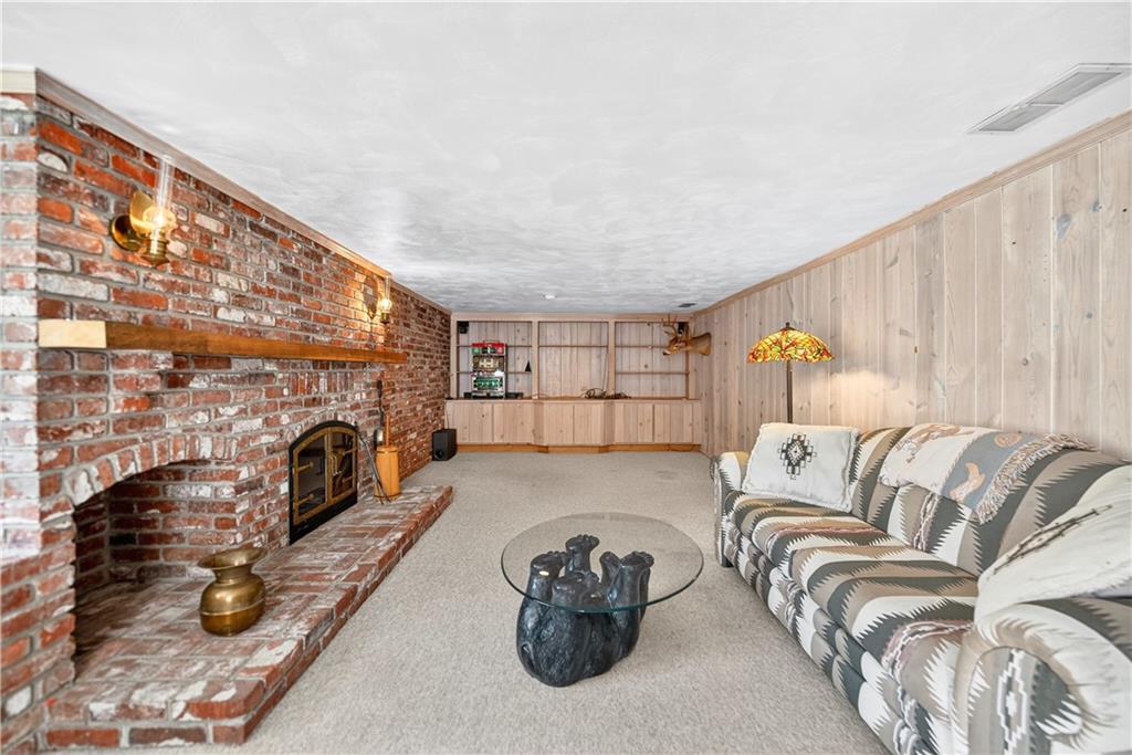 1801 McCorkle Road South Park, PA 15129 - Photo 38 of 49 a living room with furniture a fireplace and a flat screen tv