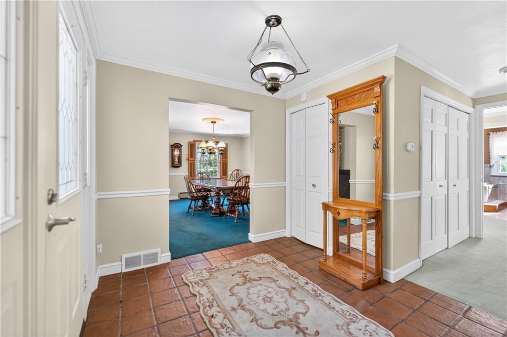 1801 McCorkle Road South Park, PA 15129 - Photo 43 of 49 a living room with furniture and a chandelier