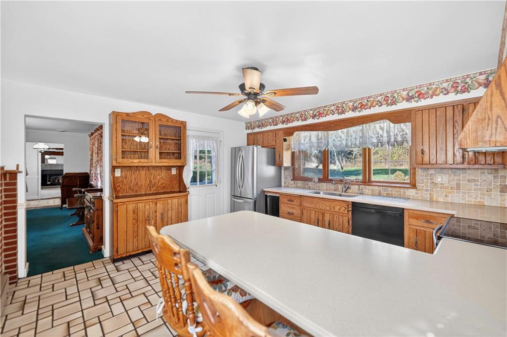 1801 McCorkle Road South Park, PA 15129 - Photo 44 of 49 a kitchen with refrigerator a stove and a sink