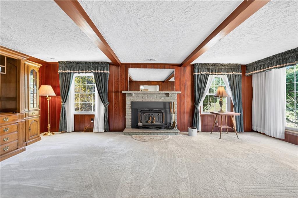 1801 McCorkle Road South Park, PA 15129 - Photo 6 of 49 a view of an empty room with a fireplace and a window
