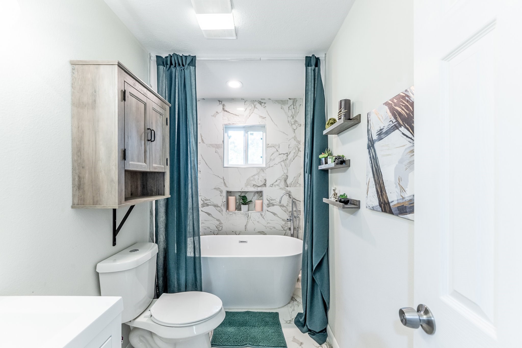 109 Monica Street Trinity, TX 75862 - Photo 12 of 32 a bathroom with a toilet sink and shower