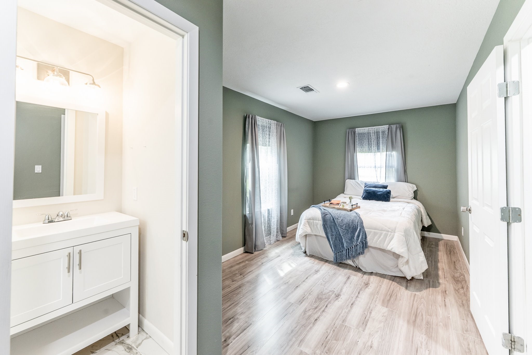 109 Monica Street Trinity, TX 75862 - Photo 16 of 32 a spacious bedroom with a bed and a window