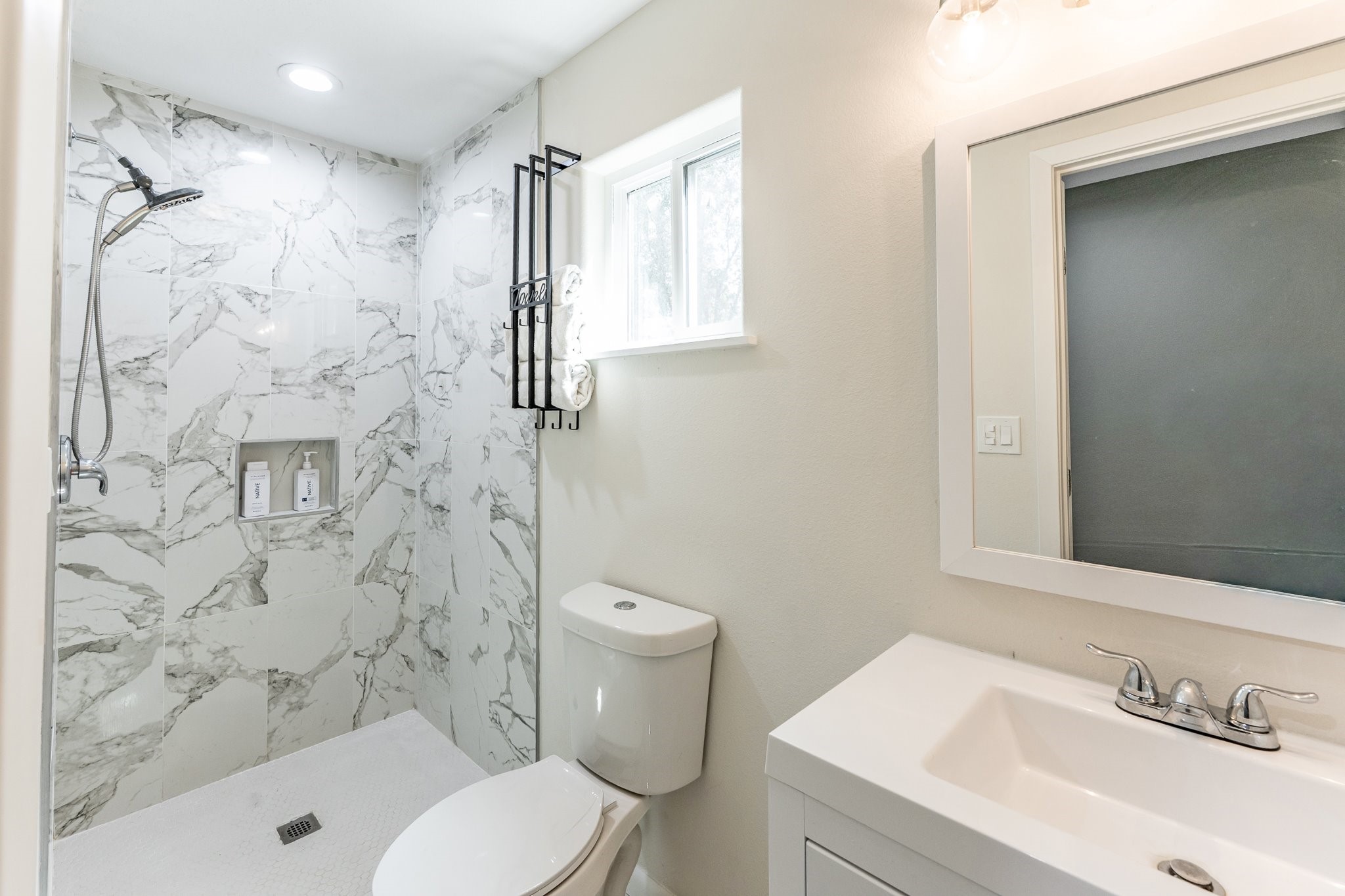 109 Monica Street Trinity, TX 75862 - Photo 17 of 32 a bathroom with a sink toilet and shower