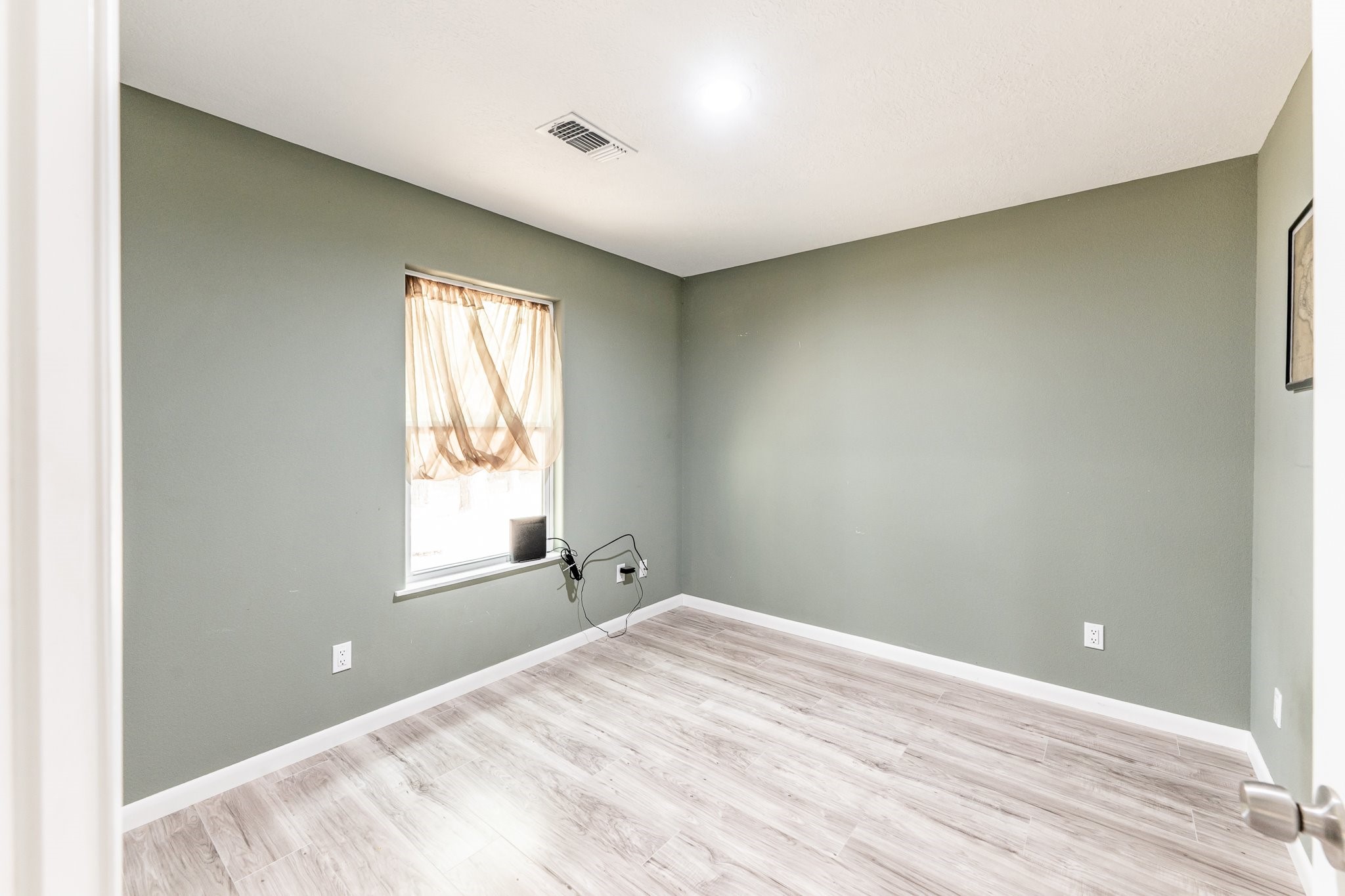 109 Monica Street Trinity, TX 75862 - Photo 23 of 32 a view of empty room with wooden floor
