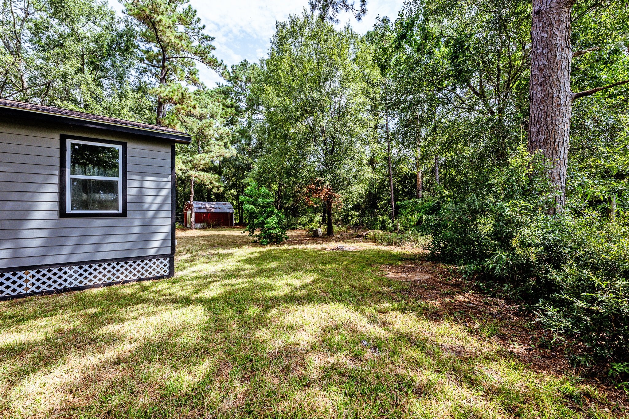 109 Monica Street Trinity, TX 75862 - Photo 26 of 32 a view of a house with a tree