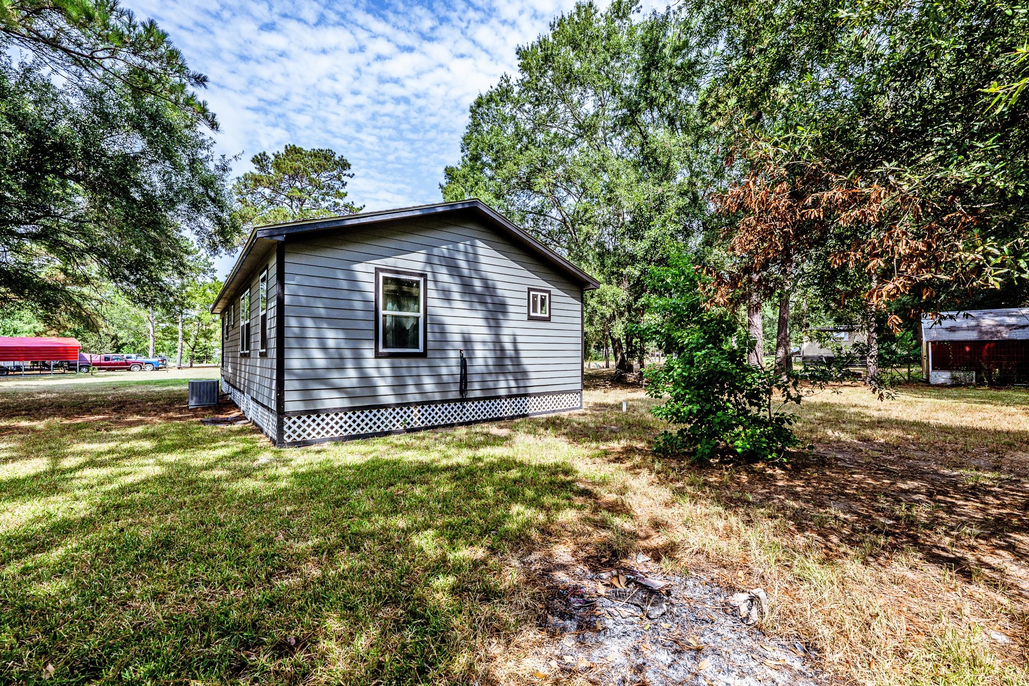 109 Monica Street Trinity, TX 75862 - Photo 27 of 32 a view of a house with a yard