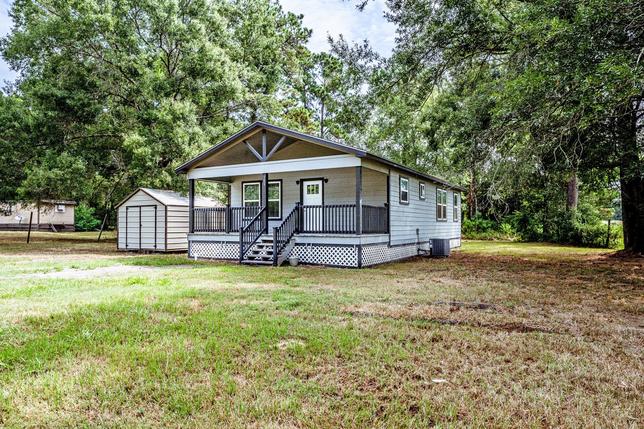 109 Monica Street Trinity, TX 75862 - Photo 32 of 32 a front view of a house with a garden