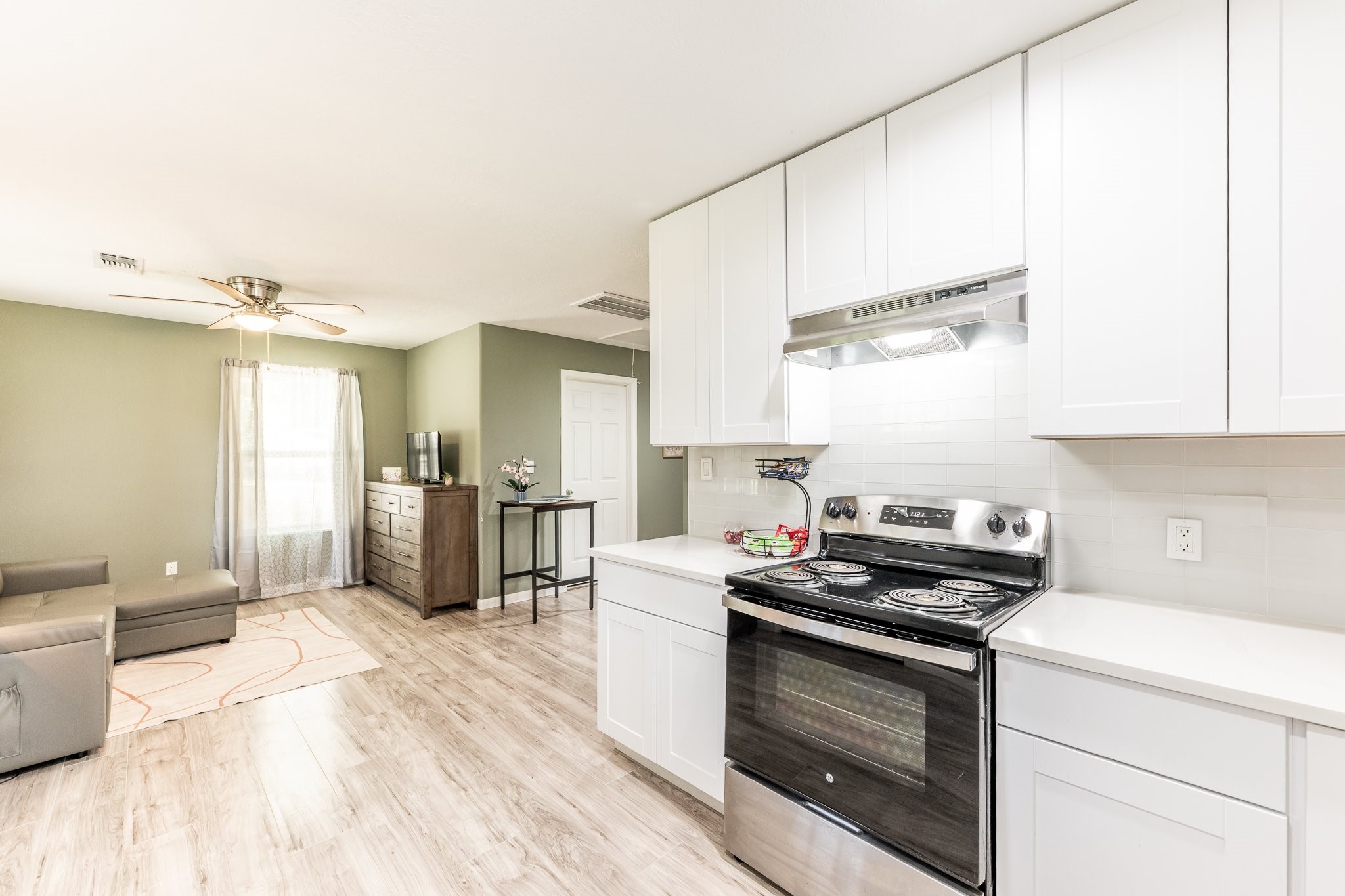 109 Monica Street Trinity, TX 75862 - Photo 6 of 32 a kitchen with a stove a sink and a refrigerator