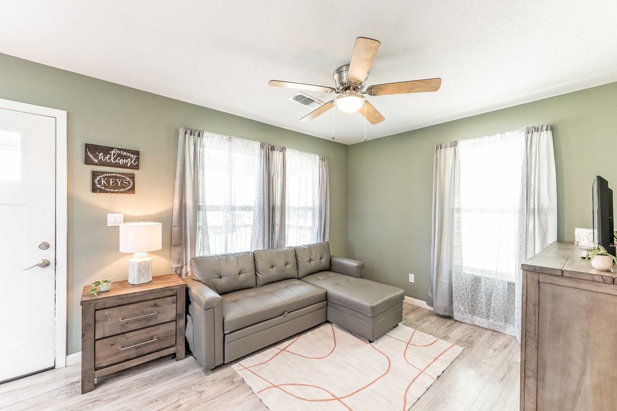 109 Monica Street Trinity, TX 75862 - Photo 9 of 32 a living room with furniture and a large window