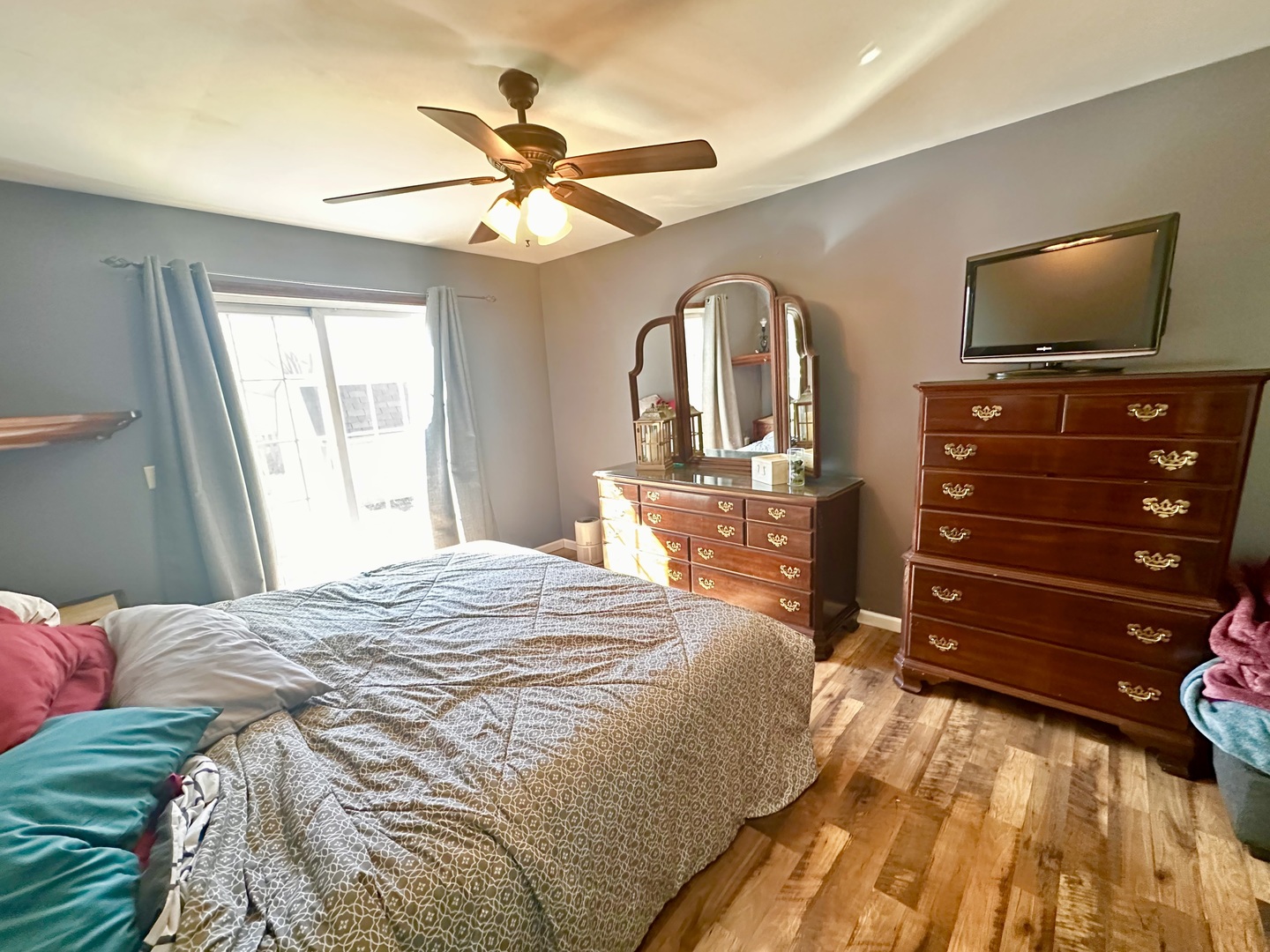 5 Shermead Road Montgomery, IL 60538 - Photo 11 of 27 a bedroom with a bed and a flat tv screen on dresser