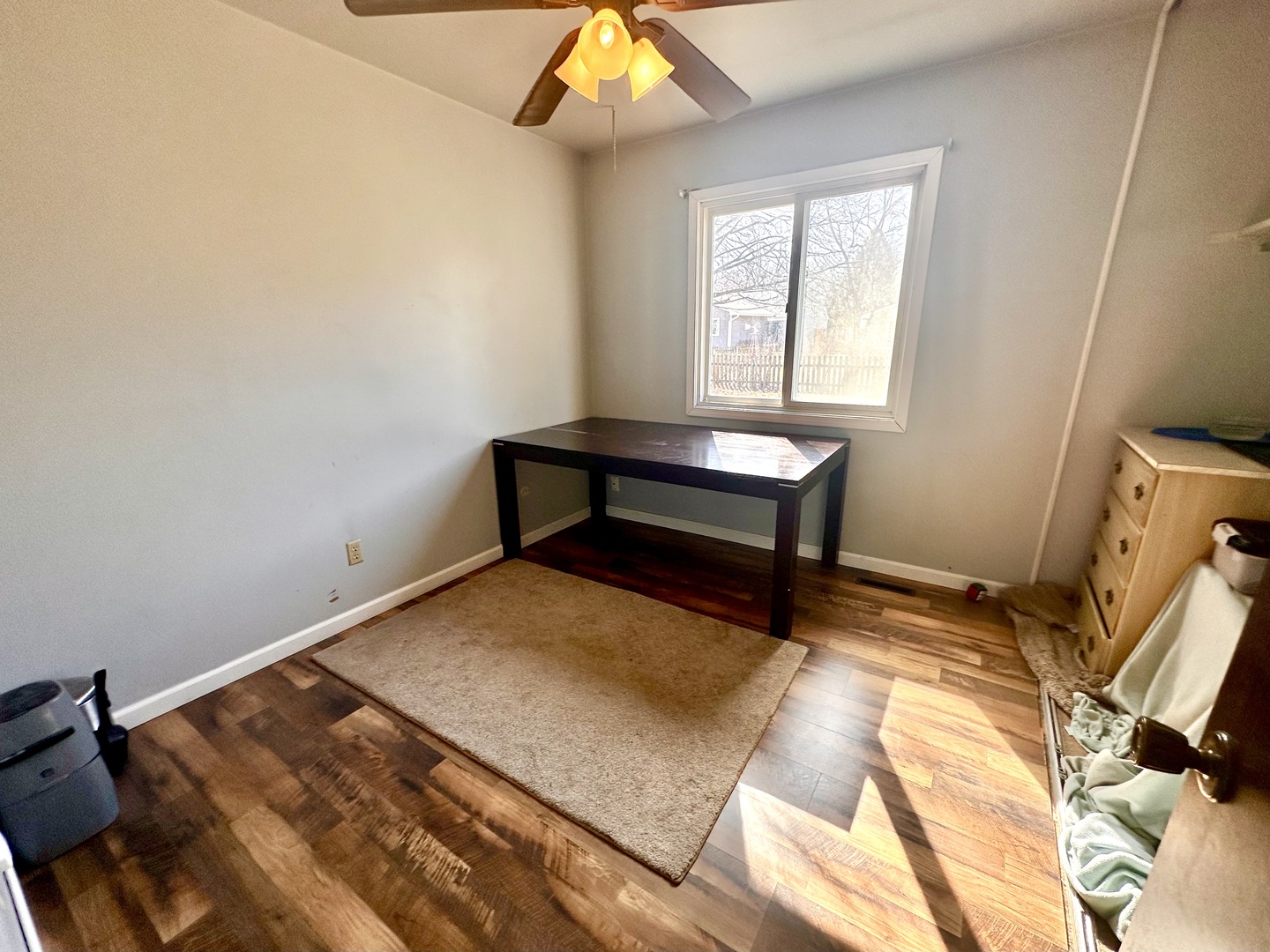 5 Shermead Road Montgomery, IL 60538 - Photo 21 of 27 a bedroom with a bed and a chandelier