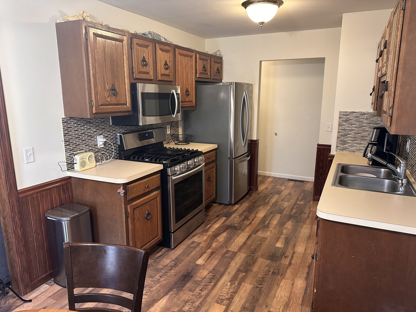5 Shermead Road Montgomery, IL 60538 - Photo 4 of 27 a kitchen with stainless steel appliances granite countertop a stove refrigerator and a microwave oven
