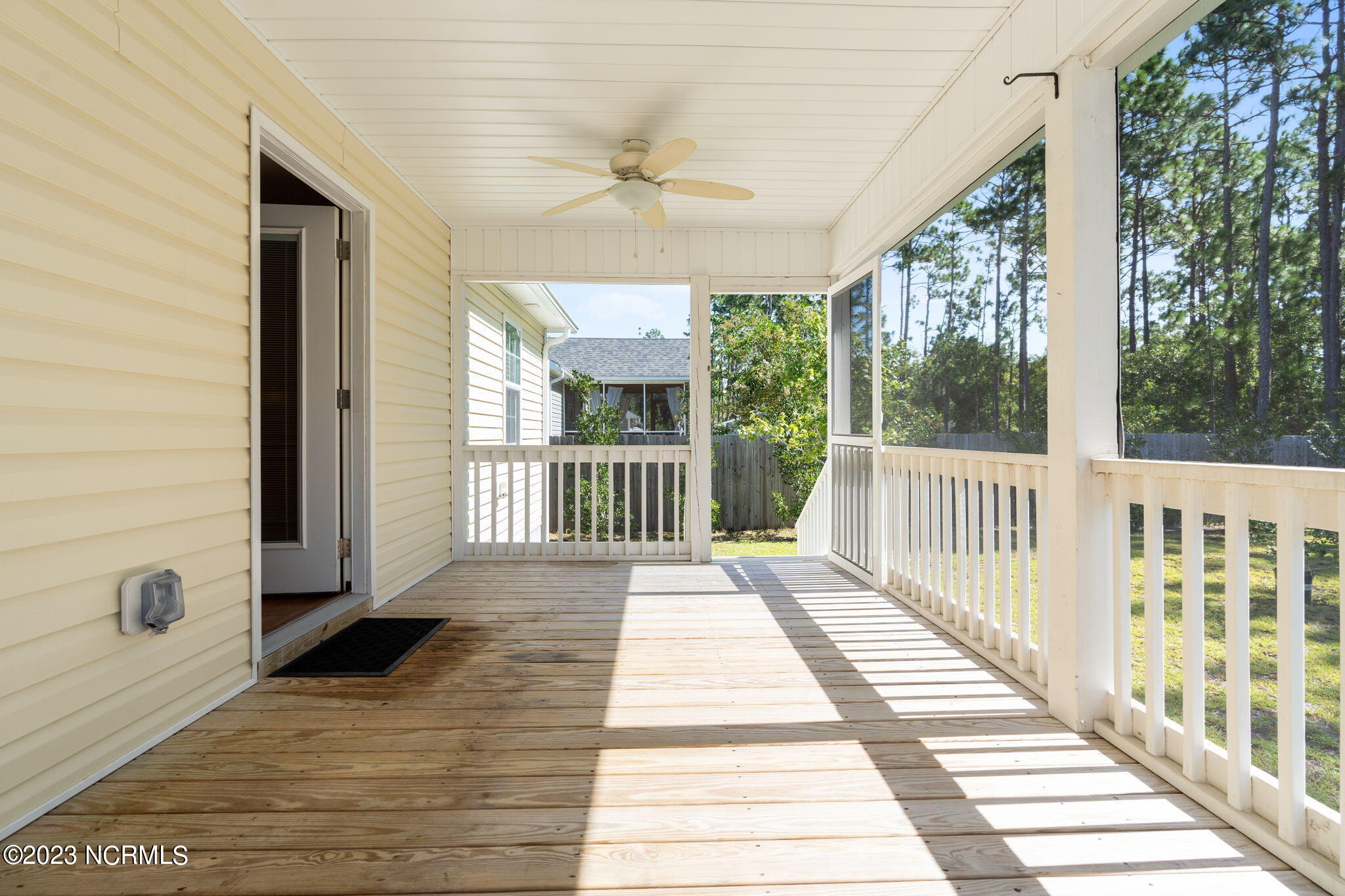 1100 Maple Road Southport, NC 28461 - Photo 9 of 46 Two ceiling fans on screen porch.