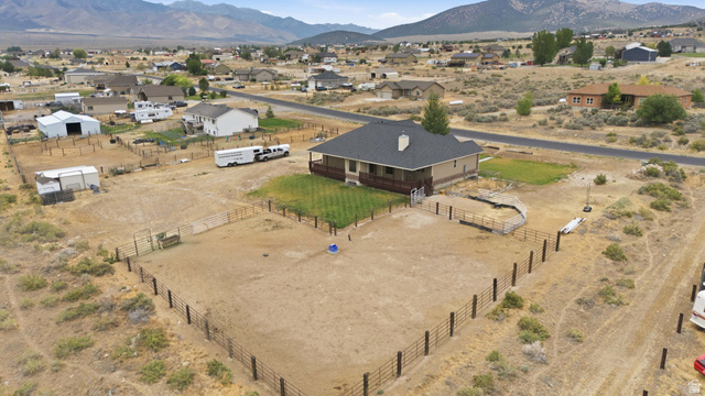 2567 West Rim Rock Drive Stockton, UT 84071 - Photo 64 of 64 Single-story residence with a dark shingle roof and a covered back deck