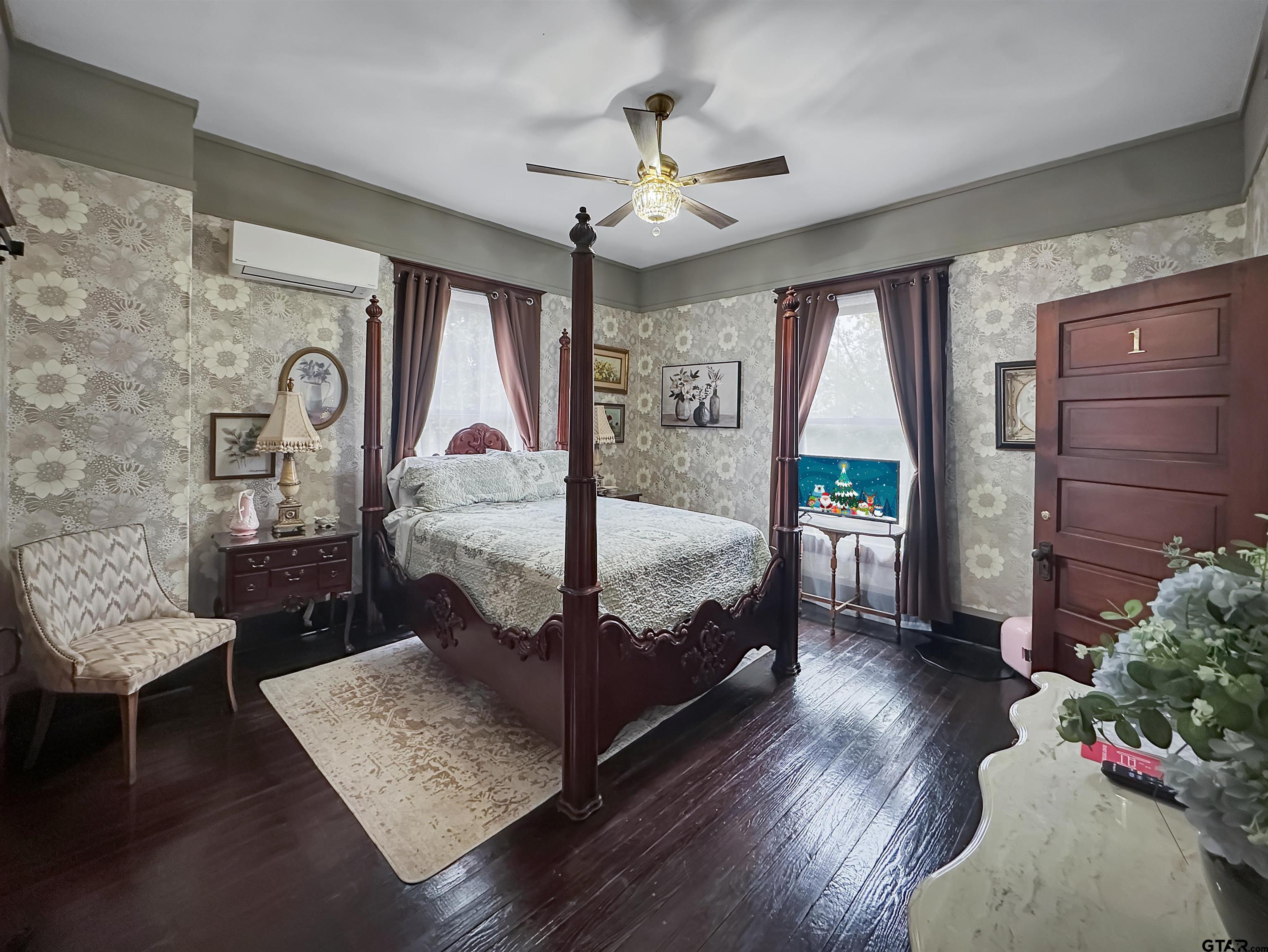 406 West 1st Street Mount Pleasant, TX 75455 - Photo 23 of 43 a bedroom with a bed window and a table