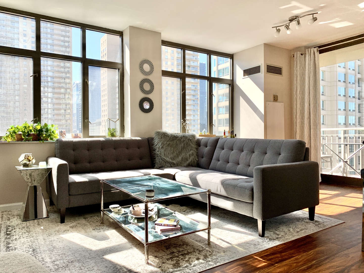 630 North State Street, Unit 2207 Chicago, IL 60654 - Photo 2 of 13 a living room with furniture and a large window