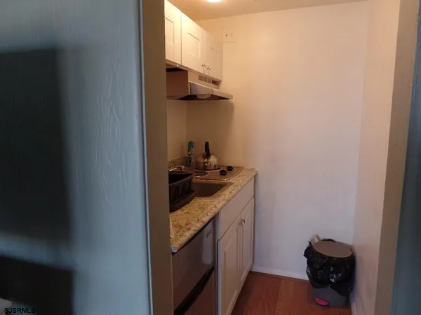 a kitchen that has a sink and a stove