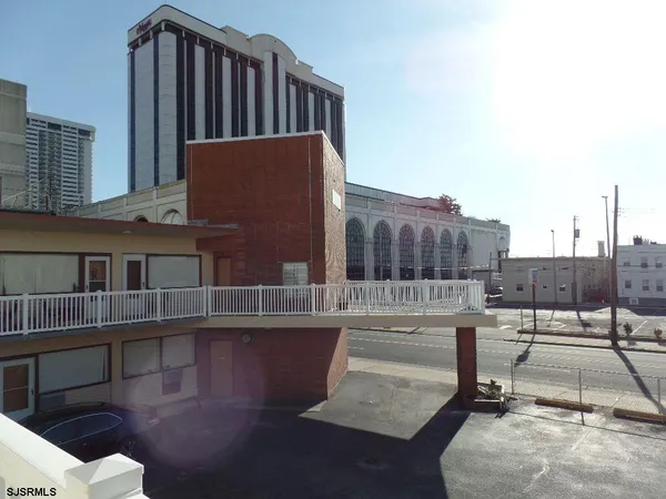 a view of balcony with seating space and hardwood floor