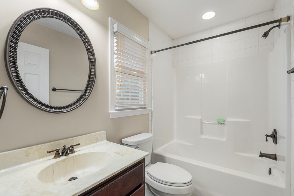 1009 Crosswinds Drive Midland, GA 31820 - Photo 12 of 29 a bathroom with a sink a toilet and a mirror